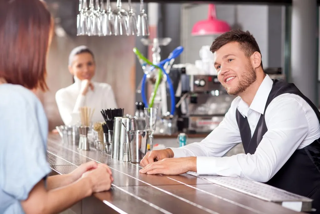 bartender talking to a woman
